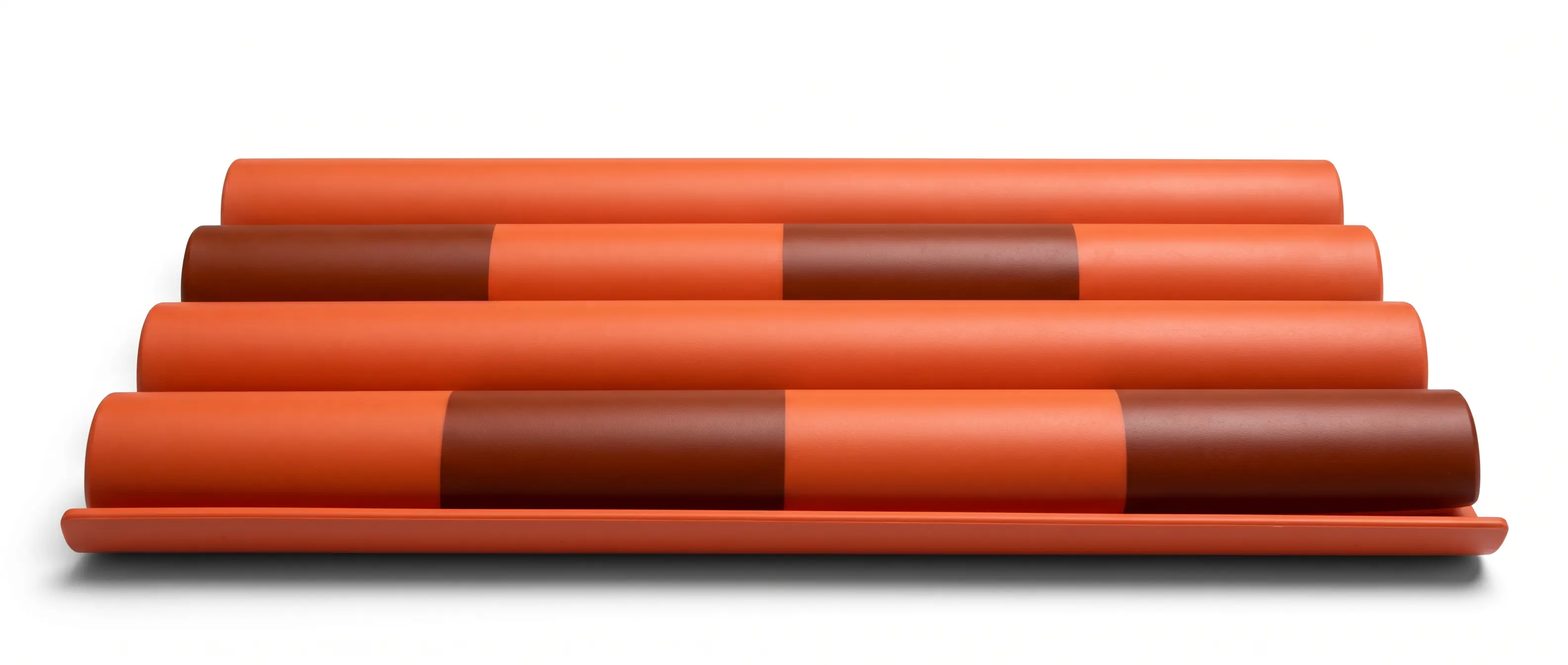 Close-up of four Plycem Eureka Sevillana tiles showing the orange and burgundy color blend and barrel profile